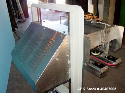 Used Elf model AC1600 (6) quill cap tightener. 3 sets of quills, last set of quills with mechanical clutch for torque application, 24 in long x 3/4 in single rubber bottle gripper belts, belt and gri...