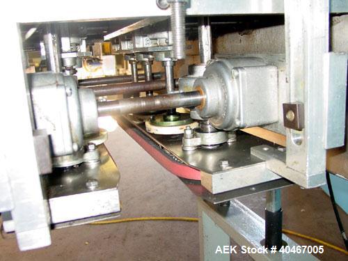 Used Elf model AC1600 (6) quill cap tightener. 3 sets of quills, last set of quills with mechanical clutch for torque application, 24 in long x 3/4 in single rubber bottle gripper belts, belt and gri...