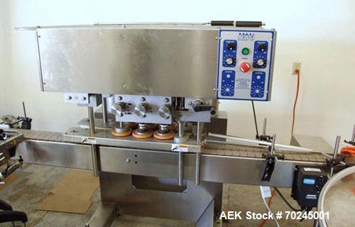 Used Acasi Model CS-5000 inline semi-automatic capper, cap tightener or retorquer. Has a cap size range: (Diam) 8mm to 100mm. Container Height: 1" to 14". All Hand crank adjustment. Stainless Steel C...