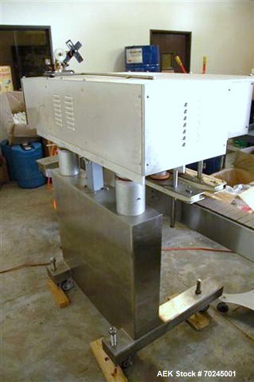 Used Acasi Model CS-5000 inline semi-automatic capper, cap tightener or retorquer. Has a cap size range: (Diam) 8mm to 100mm. Container Height: 1" to 14". All Hand crank adjustment. Stainless Steel C...