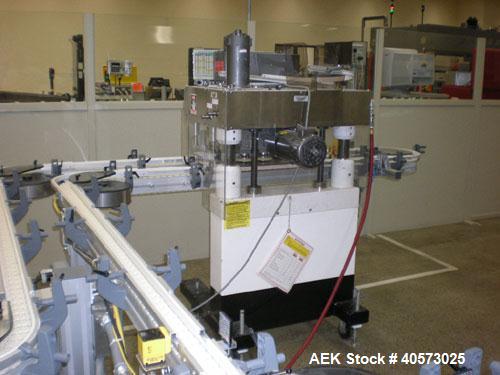 Used: Kaps-All model F4 inline quill cap tightener or retorquer capable of speeds over 150 BPM. Cap size range: 13 to 70mm. Has single belt side grippers, C frame design with painted base. Last used ...