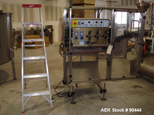 Used E-Pak (ELF) Semi Automatic Six Spindle Capper. (3) sets of (2) spindles. With cap chute feeder, cabable of speeds up to 120 CPM. Has C frame design to roll up to existing conveyor line. Cap size...