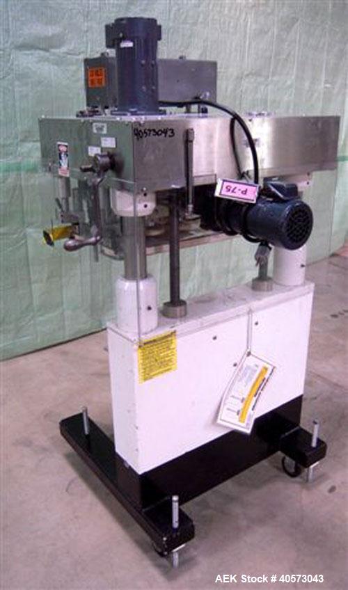 Used Kaps-All Model F4 Inline Quill Cap Tightener/Retorquer. Capable of speeds over 150 BPM. Cap size range: 13 to 70mm. Has single belt side grippers, C frame design with painted base. Last used in ...