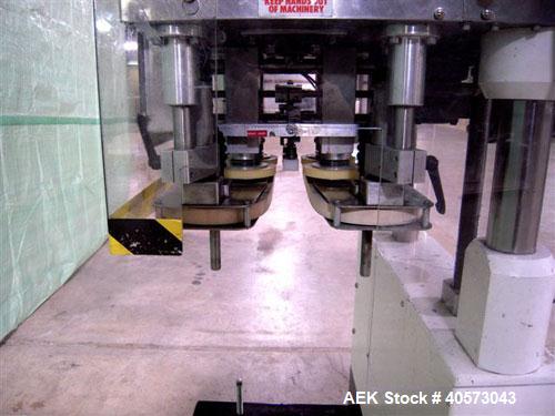 Used Kaps-All Model F4 Inline Quill Cap Tightener/Retorquer. Capable of speeds over 150 BPM. Cap size range: 13 to 70mm. Has single belt side grippers, C frame design with painted base. Last used in ...