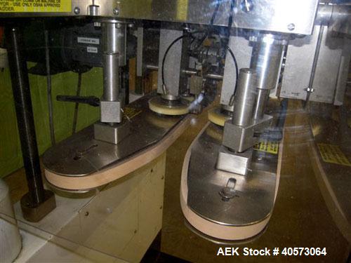 Used Kaps-All Model F4 Inline Quill Cap Tightener/Retorquer. Capable of speeds over 150 BPM. Cap size range: 13 to 70mm. Has single belt side grippers, C frame design with painted base. Last used in ...