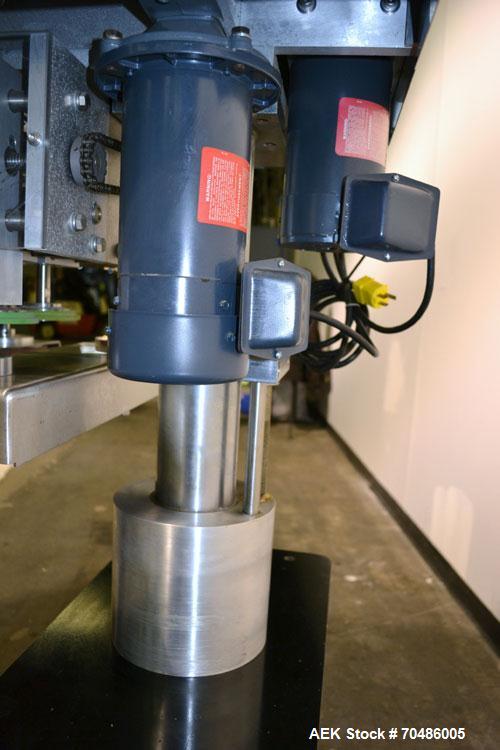 Used Filamatic (National Instruments) Model DL-4-CT 4 Quill Automatic Cap Tightening Machine. Capable of 80 containers per minute. (2) 2’’ Widex 19’’ long gripper belts, driven by a 1/2 hp, 90 volt D...