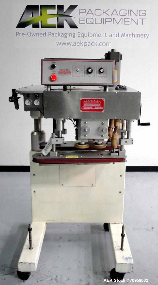Used Kaps-All Model F4 Inline Quill Cap Tightener or Retorquer. Capable of speeds over 150 BPM. Cap size range: 13 to 70 mm. Has single belt side grippers 25" long x 7/8" tall, C-frame design with pa...