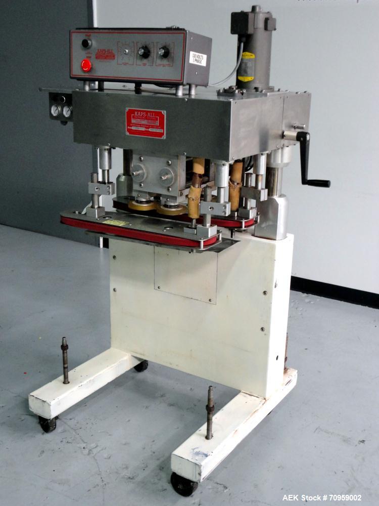 Used Kaps-All Model F4 Inline Quill Cap Tightener or Retorquer. Capable of speeds over 150 BPM. Cap size range: 13 to 70 mm. Has single belt side grippers 25" long x 7/8" tall, C-frame design with pa...