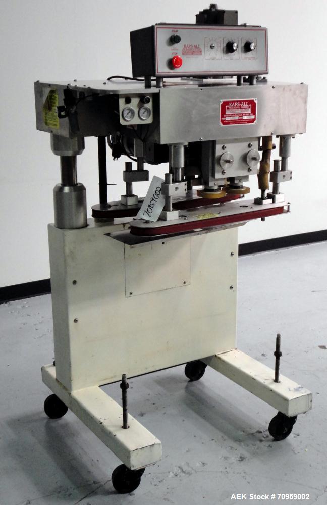 Used Kaps-All Model F4 Inline Quill Cap Tightener or Retorquer. Capable of speeds over 150 BPM. Cap size range: 13 to 70 mm. Has single belt side grippers 25" long x 7/8" tall, C-frame design with pa...