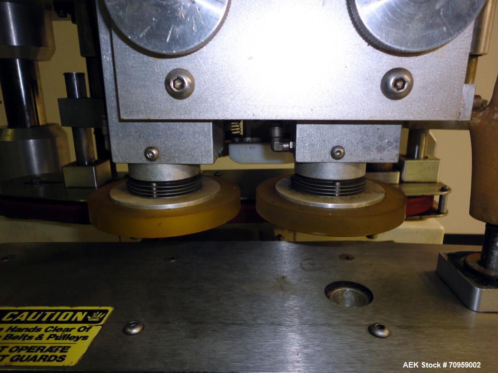 Used Kaps-All Model F4 Inline Quill Cap Tightener or Retorquer. Capable of speeds over 150 BPM. Cap size range: 13 to 70 mm. Has single belt side grippers 25" long x 7/8" tall, C-frame design with pa...