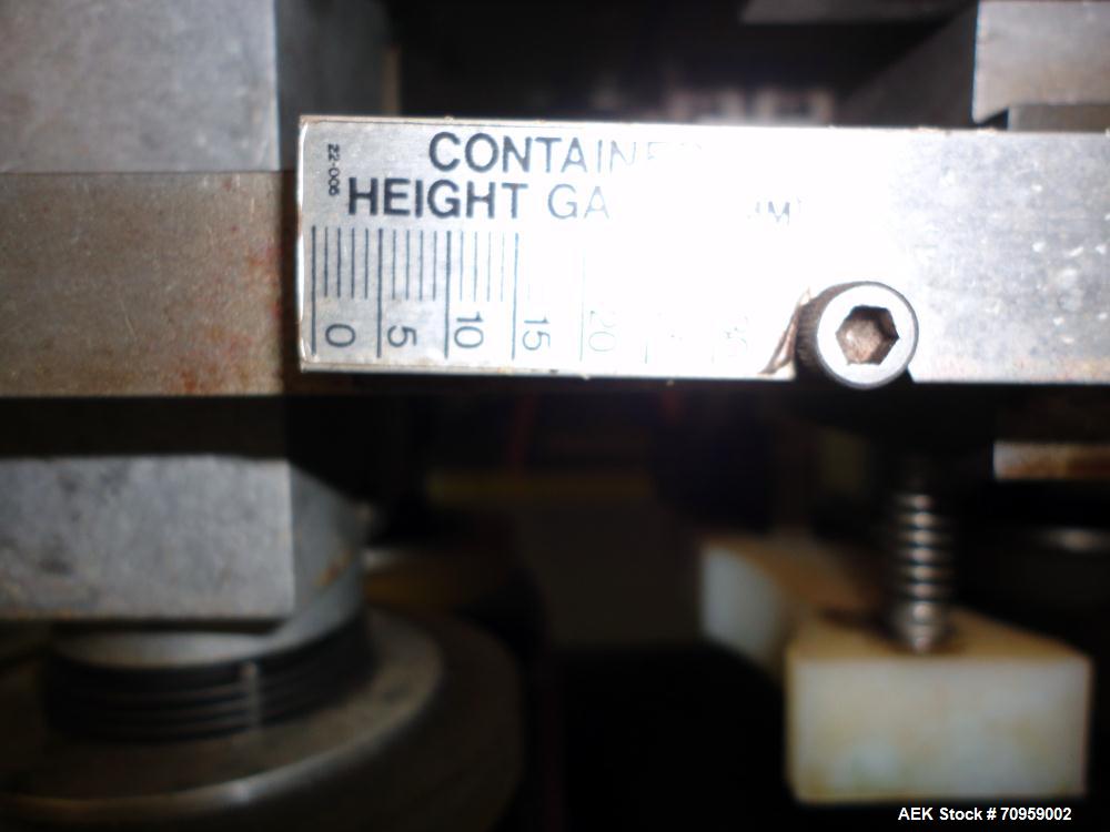 Used Kaps-All Model F4 Inline Quill Cap Tightener or Retorquer. Capable of speeds over 150 BPM. Cap size range: 13 to 70 mm. Has single belt side grippers 25" long x 7/8" tall, C-frame design with pa...