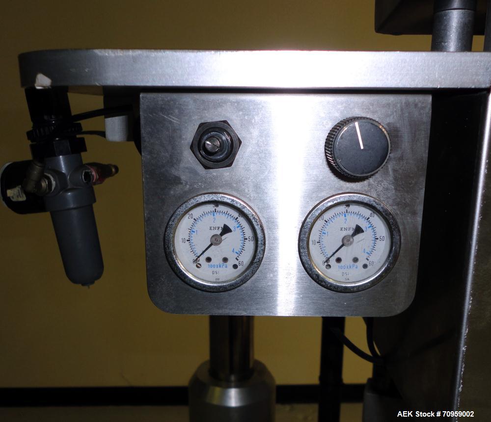 Used Kaps-All Model F4 Inline Quill Cap Tightener or Retorquer. Capable of speeds over 150 BPM. Cap size range: 13 to 70 mm. Has single belt side grippers 25" long x 7/8" tall, C-frame design with pa...