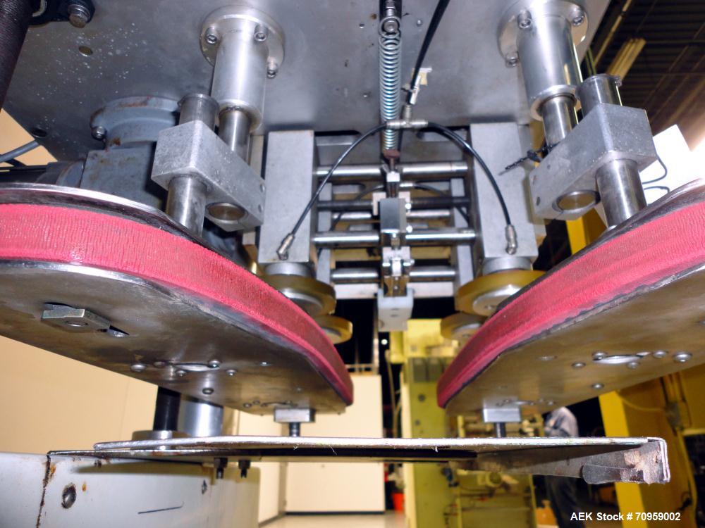 Used Kaps-All Model F4 Inline Quill Cap Tightener or Retorquer. Capable of speeds over 150 BPM. Cap size range: 13 to 70 mm. Has single belt side grippers 25" long x 7/8" tall, C-frame design with pa...