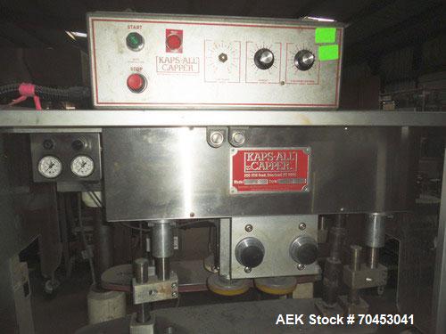 Used: Kaps-All Model F4 Inline Quill Cap Tightener or retorquer capable of speeds over 150 BPM. Cap size range 13 to 70mm. Has single belt side grippers, C-frame design with painted base. Last used i...