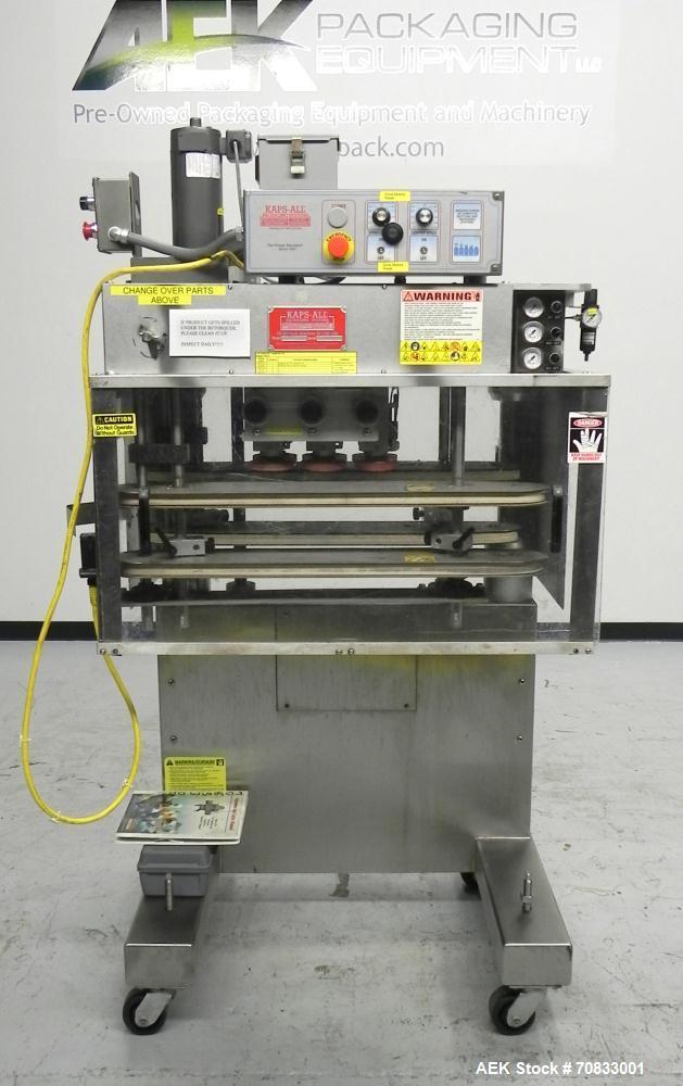 Used Kaps-All Model FA6 Industrial 6-Spindle Cap Retorquer. Machine is capable of speeds from 20 to 200 bottles per minute. Can handle caps of all materials from 8mm to 70mm (diameter). Can do pilfer...