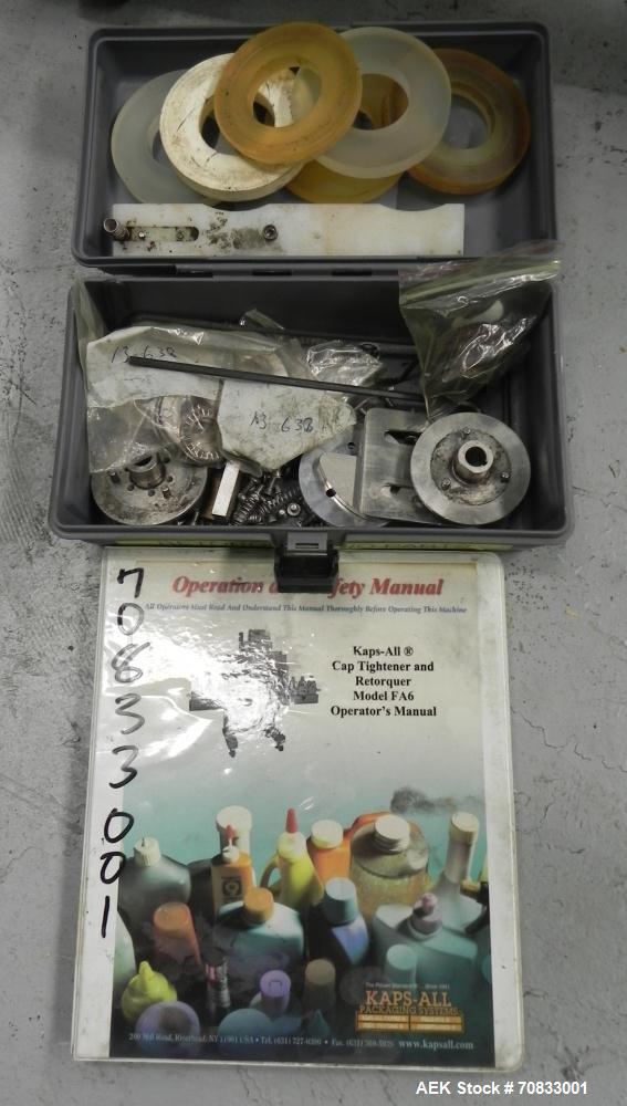 Used Kaps-All Model FA6 Industrial 6-Spindle Cap Retorquer. Machine is capable of speeds from 20 to 200 bottles per minute. Can handle caps of all materials from 8mm to 70mm (diameter). Can do pilfer...
