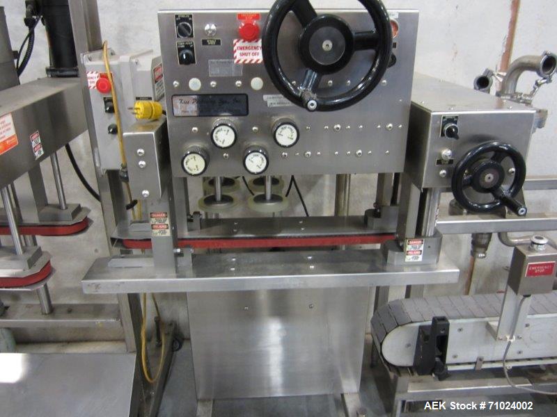 Used Kiss Packaging Model CT-04 Automatic Cap Tightener/Retorquer. Capable of speeds over 100 containers per minute. Has an adjustable cap size range from 13mm - 110mm. Has single belt grippers, hand...