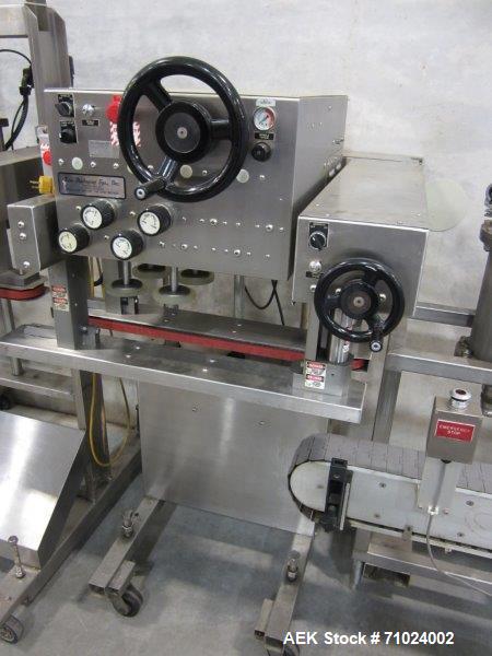 Used Kiss Packaging Model CT-04 Automatic Cap Tightener/Retorquer. Capable of speeds over 100 containers per minute. Has an adjustable cap size range from 13mm - 110mm. Has single belt grippers, hand...