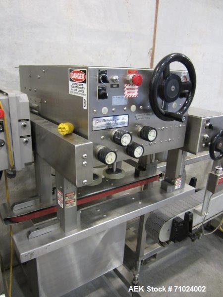 Used Kiss Packaging Model CT-04 Automatic Cap Tightener/Retorquer. Capable of speeds over 100 containers per minute. Has an adjustable cap size range from 13mm - 110mm. Has single belt grippers, hand...