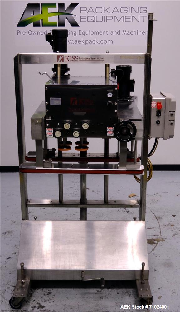 Used Kiss Packaging Model VCT-04 Automatic Cap Tightener/Retorquer. Capable of speeds over 100 containers per minute. Has an adjustable cap size range from 13mm - 110mm. Has 32" long single side belt...