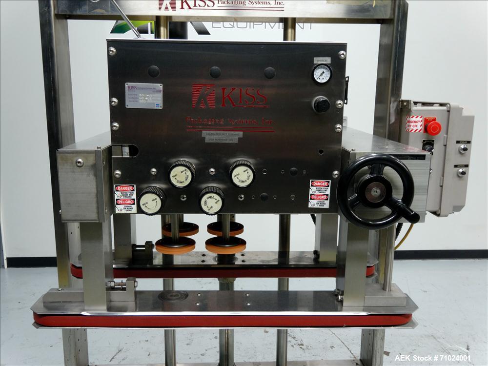 Used Kiss Packaging Model VCT-04 Automatic Cap Tightener/Retorquer. Capable of speeds over 100 containers per minute. Has an adjustable cap size range from 13mm - 110mm. Has 32" long single side belt...