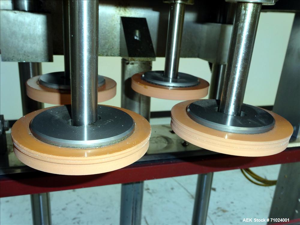 Used Kiss Packaging Model VCT-04 Automatic Cap Tightener/Retorquer. Capable of speeds over 100 containers per minute. Has an adjustable cap size range from 13mm - 110mm. Has 32" long single side belt...