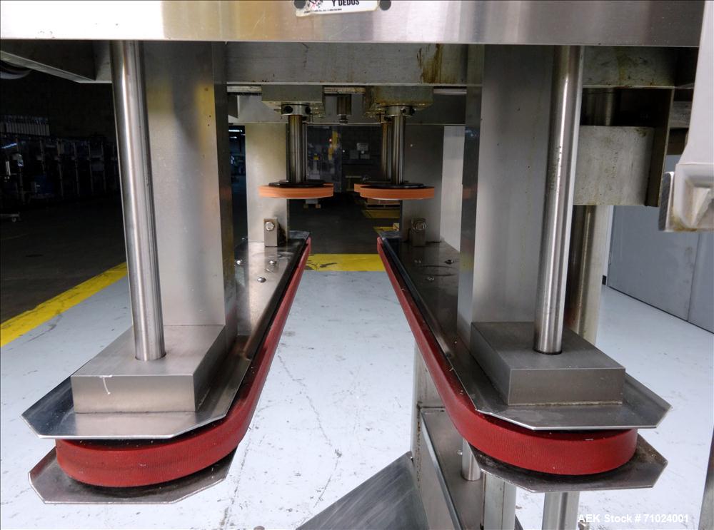 Used Kiss Packaging Model VCT-04 Automatic Cap Tightener/Retorquer. Capable of speeds over 100 containers per minute. Has an adjustable cap size range from 13mm - 110mm. Has 32" long single side belt...