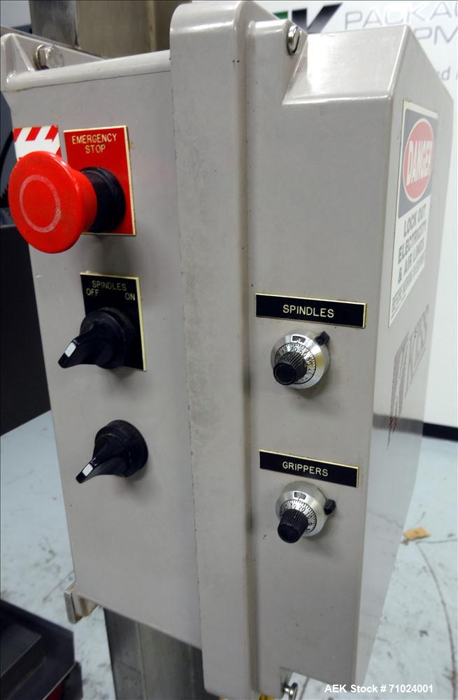 Used Kiss Packaging Model VCT-04 Automatic Cap Tightener/Retorquer. Capable of speeds over 100 containers per minute. Has an adjustable cap size range from 13mm - 110mm. Has 32" long single side belt...