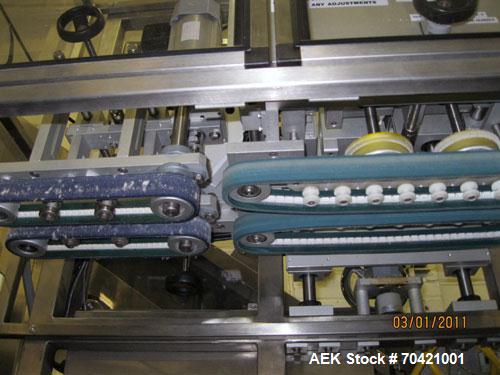 Used New England Machinery Cap Tightener and Retorquer, Model NEPMTE-1F-DB-2. Has dual cap tightening spindles. Single belt grippers. Cap size range:  12 mm to 100 mm or .5" to 4".  Container speeds ...