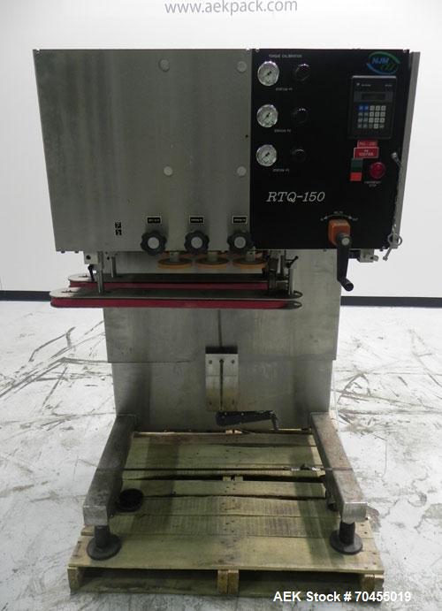 Used New Jersey Machine Model RTQ-150 Cap Tightener and Retorquer. Capable of speeds up to 300 bottles per minute. Stainless steel frame, mounts over existing conveyor. Has single side gripper belts....