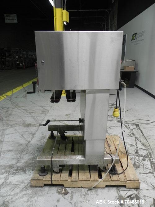 Used New Jersey Machine Model RTQ-150 Cap Tightener and Retorquer. Capable of speeds up to 300 bottles per minute. Stainless steel frame, mounts over existing conveyor. Has single side gripper belts....