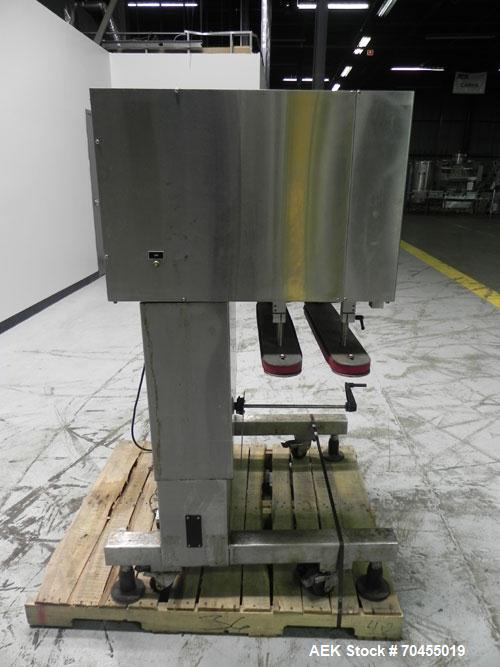 Used New Jersey Machine Model RTQ-150 Cap Tightener and Retorquer. Capable of speeds up to 300 bottles per minute. Stainless steel frame, mounts over existing conveyor. Has single side gripper belts....