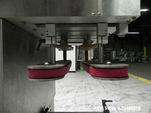 Used New Jersey Machine Model RTQ-150 Cap Tightener and Retorquer. Capable of speeds up to 300 bottles per minute. Stainless steel frame, mounts over existing conveyor. Has single side gripper belts....