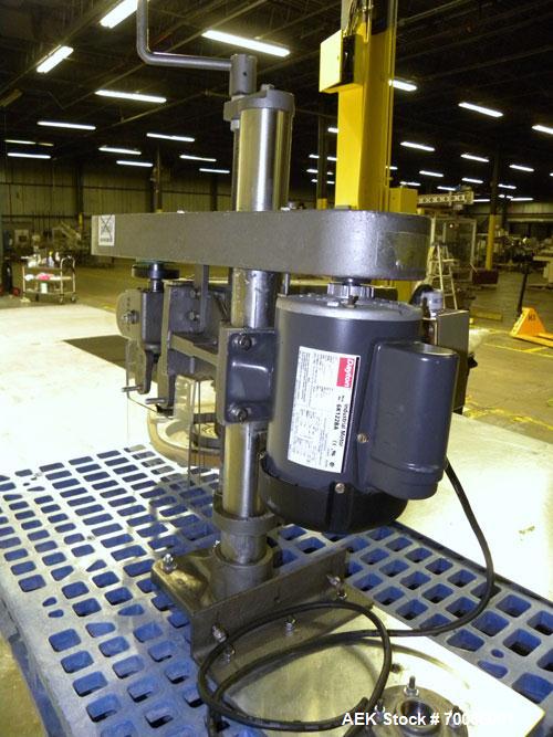 Used Kinsley Universal Roll-Tite Semi- Automatic Two Spindle Cap Tightener/ Retorquer, Model DM4350. Capable of speeds up to 200 containers per minute. Cap size range maximum 5-3/8’’ diameter without...