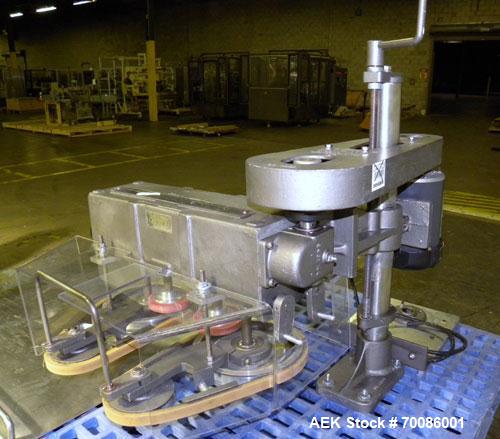 Used Kinsley Universal Roll-Tite Semi- Automatic Two Spindle Cap Tightener/ Retorquer, Model DM4350. Capable of speeds up to 200 containers per minute. Cap size range maximum 5-3/8’’ diameter without...