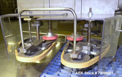 Used Kinsley Universal Roll-Tite Semi- Automatic Two Spindle Cap Tightener/ Retorquer, Model DM4350. Capable of speeds up to 200 containers per minute. Cap size range maximum 5-3/8’’ diameter without...