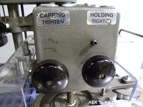 Used Kinsley Universal Roll-Tite Semi- Automatic Two Spindle Cap Tightener/ Retorquer, Model DM4350. Capable of speeds up to 200 containers per minute. Cap size range maximum 5-3/8’’ diameter without...