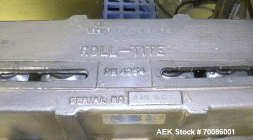 Used Kinsley Universal Roll-Tite Semi- Automatic Two Spindle Cap Tightener/ Retorquer, Model DM4350. Capable of speeds up to 200 containers per minute. Cap size range maximum 5-3/8’’ diameter without...