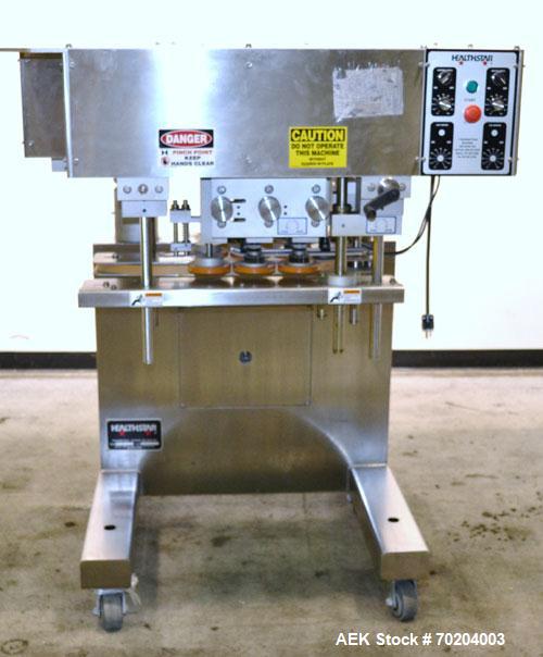 Used Healthstar Puretorque Cap Tightener & Retorquer, Model PT 500. Capable of speeds over 200 bottles per minute. Has six quills and single side belt grippers (double grip station can be added for t...