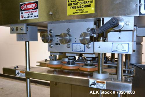 Used Healthstar Puretorque Cap Tightener & Retorquer, Model PT 500. Capable of speeds over 200 bottles per minute. Has six quills and single side belt grippers (double grip station can be added for t...