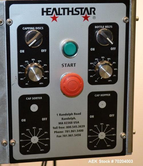Used Healthstar Puretorque Cap Tightener & Retorquer, Model PT 500. Capable of speeds over 200 bottles per minute. Has six quills and single side belt grippers (double grip station can be added for t...