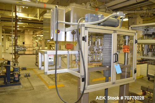 Used Resina Model RT-20 cap tightener retorquer. Capable of speeds up to 90 bottles per minute. Cap size range: 13mm t0 38mm. C frame desing, has two sets of cap tightening wheel, single side belt gr...