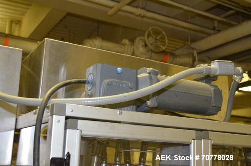 Used Resina Model RT-20 cap tightener retorquer. Capable of speeds up to 90 bottles per minute. Cap size range: 13mm t0 38mm. C frame desing, has two sets of cap tightening wheel, single side belt gr...