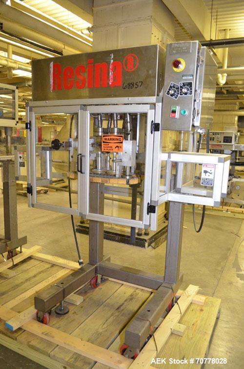 Used Resina Model RT-20 cap tightener retorquer. Capable of speeds up to 90 bottles per minute. Cap size range: 13mm t0 38mm. C frame desing, has two sets of cap tightening wheel, single side belt gr...