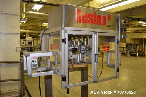 Used Resina Model RT-20 cap tightener retorquer. Capable of speeds up to 90 bottles per minute. Cap size range: 13mm t0 38mm. C frame desing, has two sets of cap tightening wheel, single side belt gr...