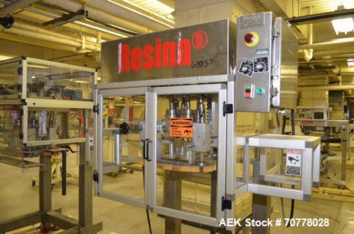 Used Resina Model RT-20 cap tightener retorquer. Capable of speeds up to 90 bottles per minute. Cap size range: 13mm t0 38mm. C frame desing, has two sets of cap tightening wheel, single side belt gr...