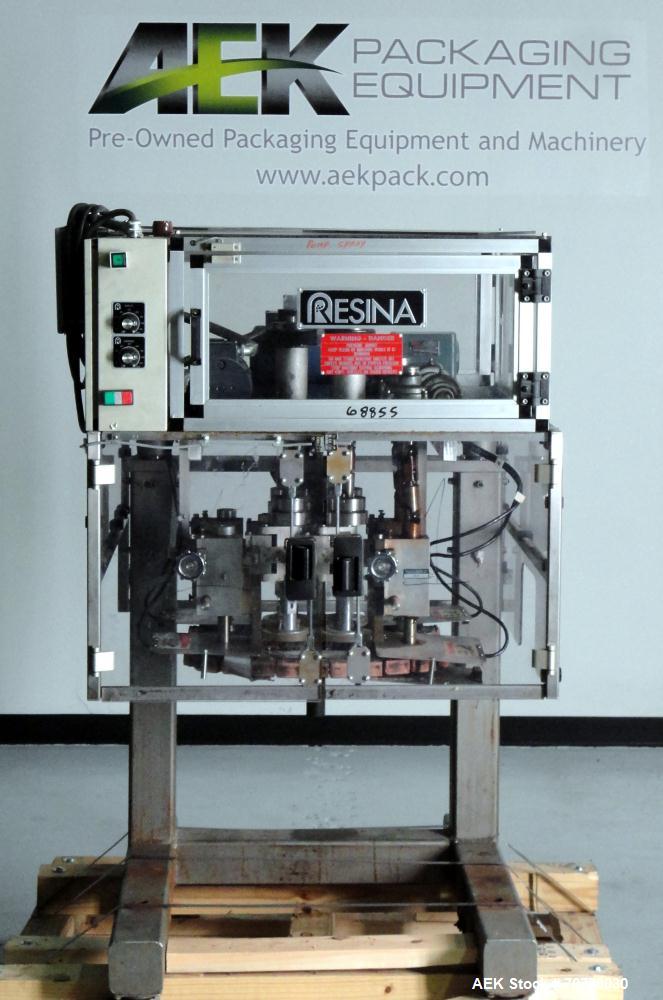 Used Resina Model RT-20 Cap Tightener Retorquer capable of speeds up to 90 bottles per minute. Cap size range: 13mm to 38mm. C frame design, has two sets of cap tightening wheels, single side belt gr...