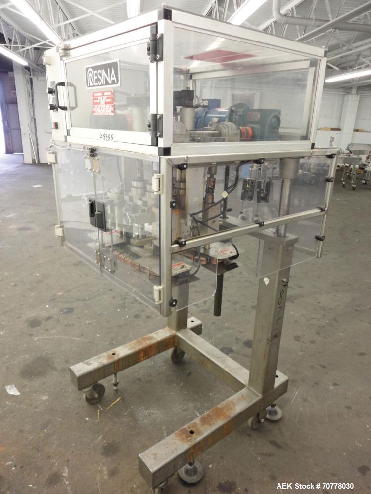 Used Resina Model RT-20 Cap Tightener Retorquer capable of speeds up to 90 bottles per minute. Cap size range: 13mm to 38mm. C frame design, has two sets of cap tightening wheels, single side belt gr...
