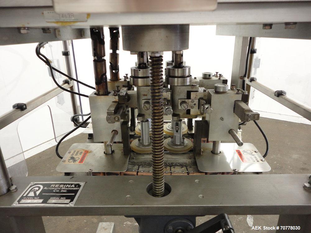 Used Resina Model RT-20 Cap Tightener Retorquer capable of speeds up to 90 bottles per minute. Cap size range: 13mm to 38mm. C frame design, has two sets of cap tightening wheels, single side belt gr...