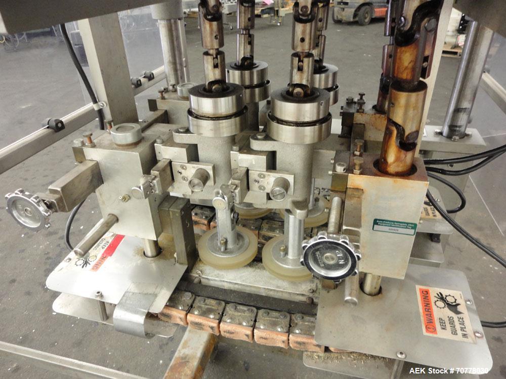 Used Resina Model RT-20 Cap Tightener Retorquer capable of speeds up to 90 bottles per minute. Cap size range: 13mm to 38mm. C frame design, has two sets of cap tightening wheels, single side belt gr...